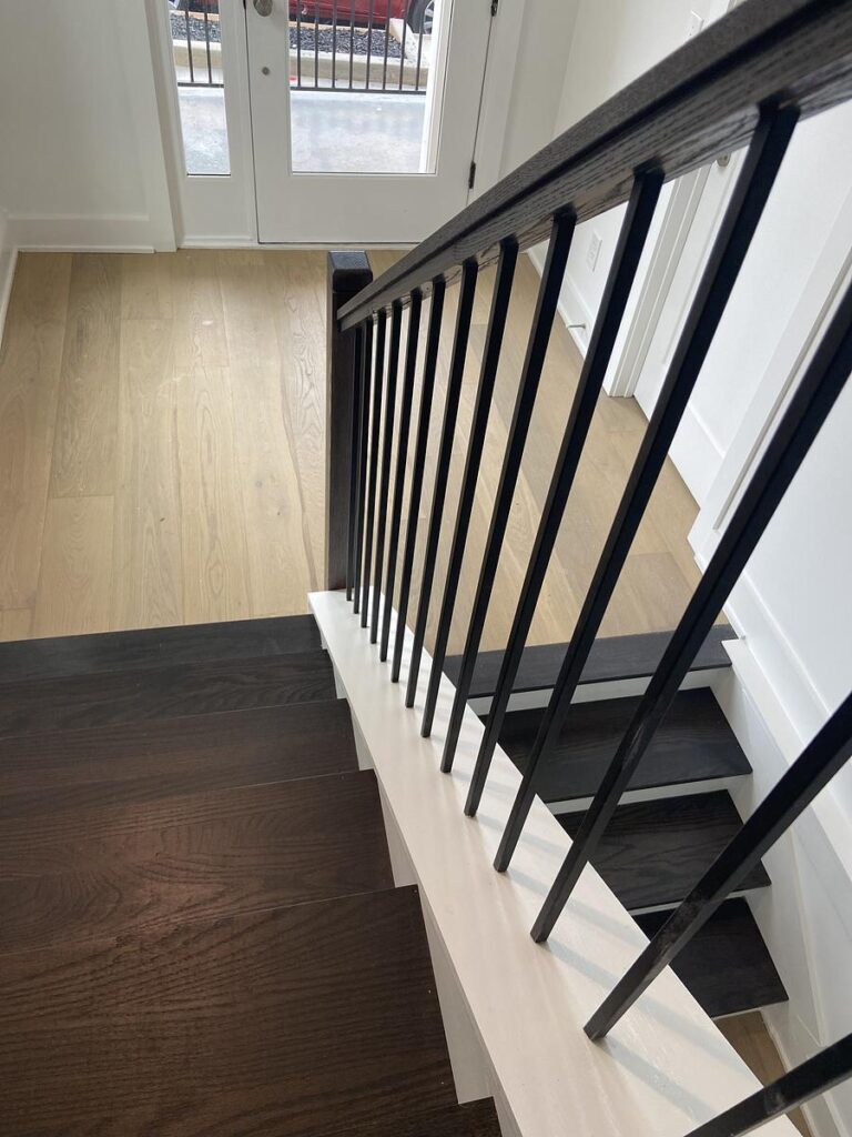 wooden treads for modern stairs and iron balusters