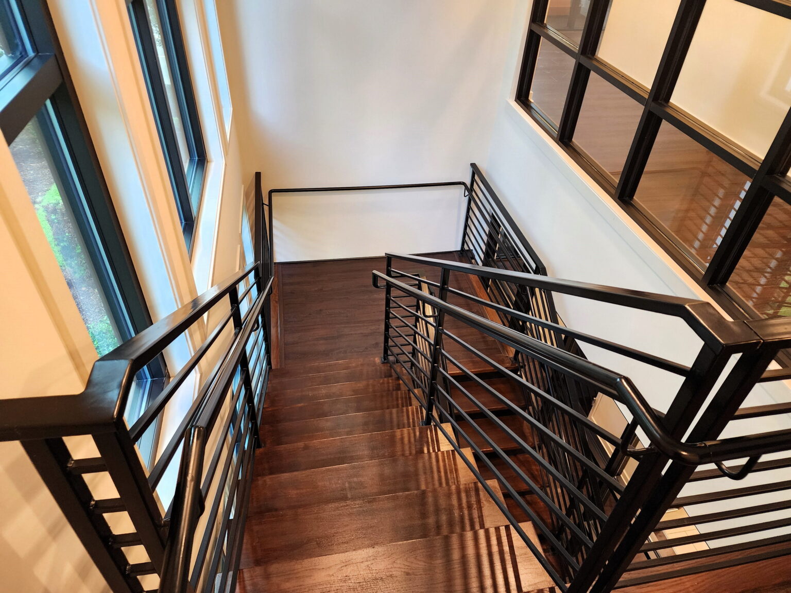 Modern Staircase Ideas (Conway, SC open riser stairs dual sawcut stringers with 4 white oak treads and custom welded modern black metal rail system)